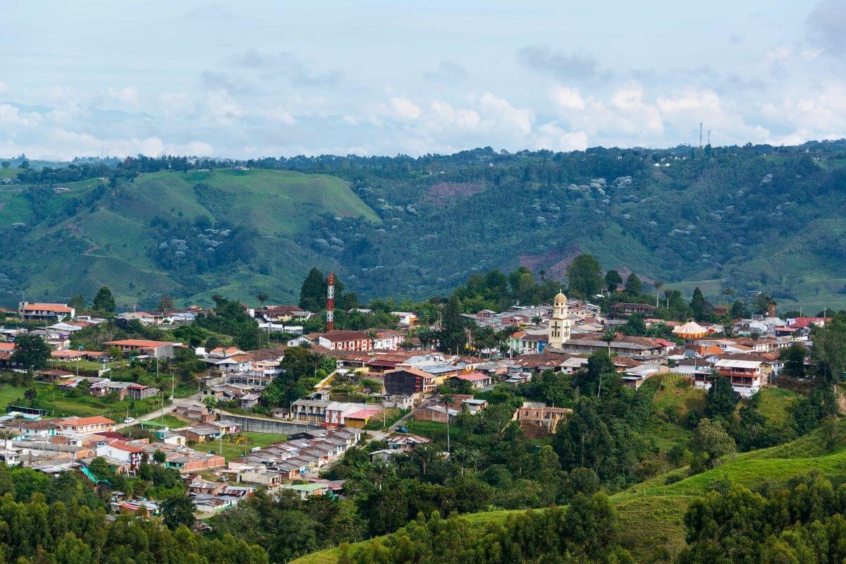 Aerial view of Salento town surrounded by green Andean mountains