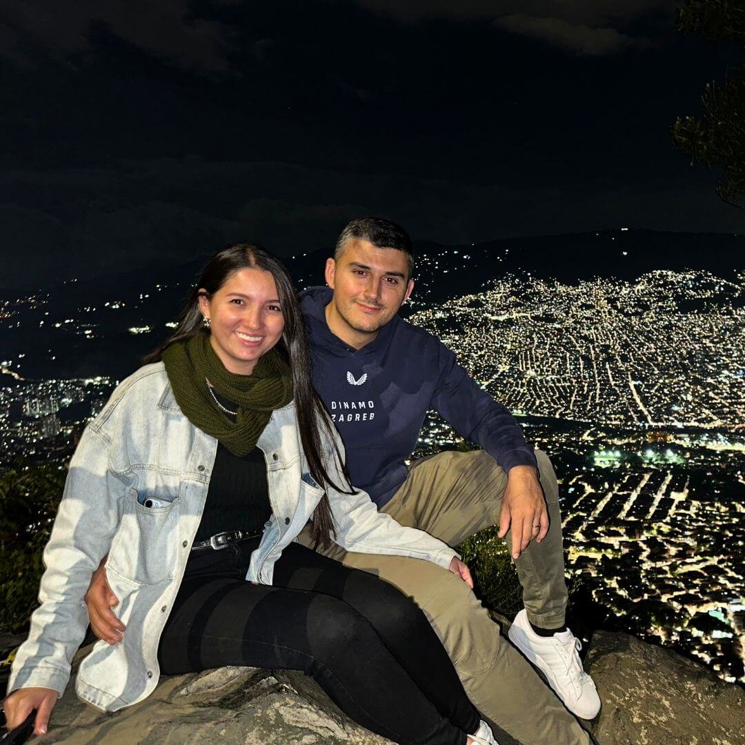 Tatiana and Goran – the Colombian-Croatian couple behind Medellín Insider, overlooking Medellin at night