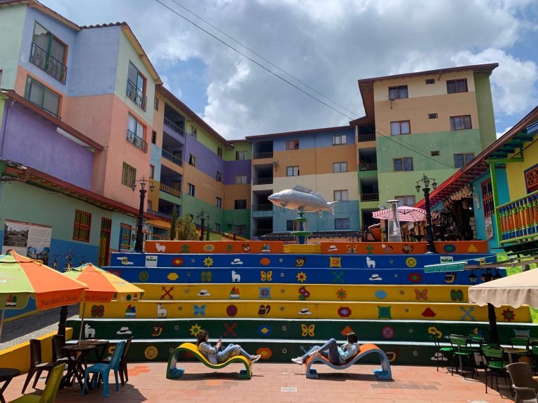 Plaza del Zócalo – colorful square in the heart of Guatape with painted stairs and houses Colorful stairs at Plaza del Zócalo in Guatape, surrounded by zócalo-painted buildings and cafés
